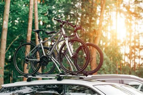 Premium Photo | Car is transporting bicycles on the roof roof mount for ...