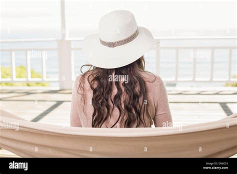 Pretty Brunette Relaxing On A Hammock Stock Photo Alamy