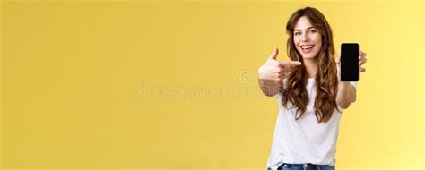 Cheerful Sassy Good Looking Sociable Girl Curly Long Hair Extend Arm Holding Smartphone Pointing