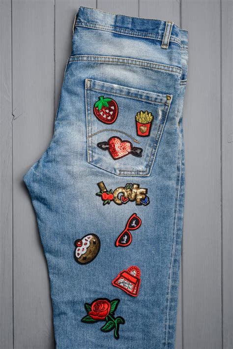 Jeans Embellished with Embroidered Patches Stock Photo - Image of ...