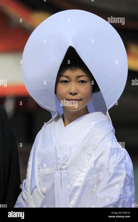 A Bride In Traditional Japanese Bridal Kimono And Headdress During A