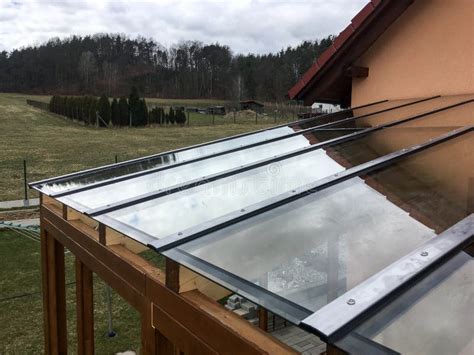 The Detail of the Transparent Glass Roof of the Wooden Pergola. Stock ...