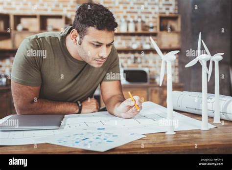 Concentrated Brunette Male Staring At Blueprint Stock Photo Alamy