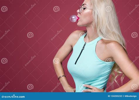 Beautiful Blonde Woman Blowing Pink Bubble Gum Girl Listen Music In