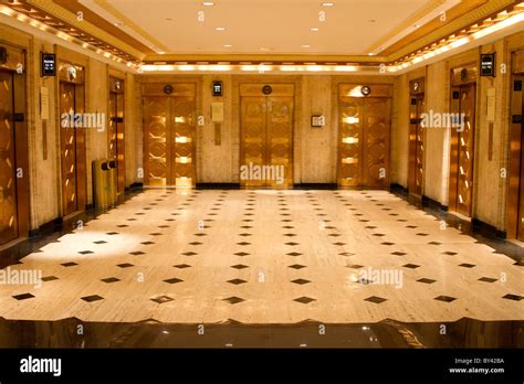 Building Lobby With Golden Elevators Stock Photo Alamy