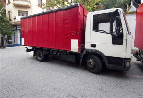 Red Semi-trailer Trucks Parked at City Center Stock Photo - Image of ...