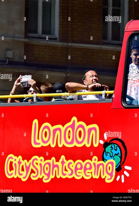 London England UK Tourists On The Top Floor Of An Open Top