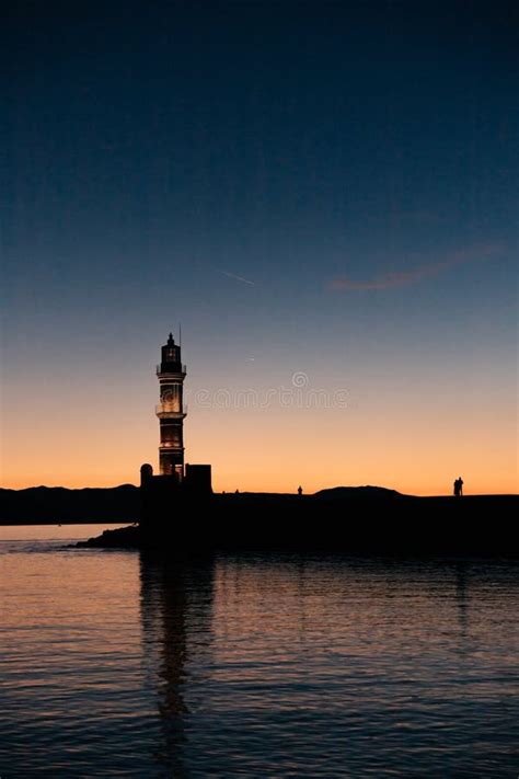 View Of Old Venetian Harbour Waterfront And Lighthouse In Sunset Time