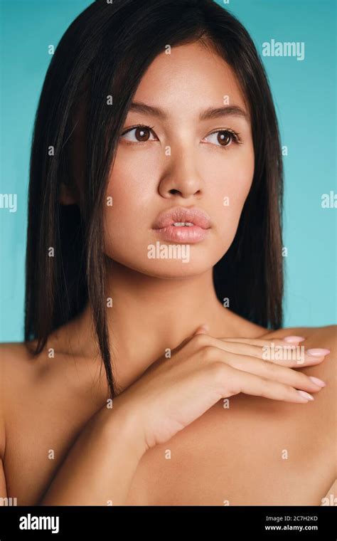 Portrait Of Gorgeous Asian Brunette Girl Thoughtfully Looking Away Over