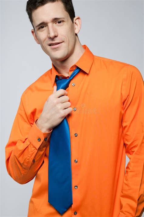 Happy Man In Orange Shirt And Blue Tie Stock Photo Image Of Person