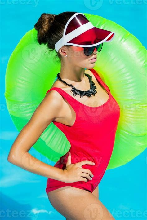 Sexy Tanned Woman In Red Swimsuit Having Fun And Enjoying Summer In Amazing Big Swimming Pool