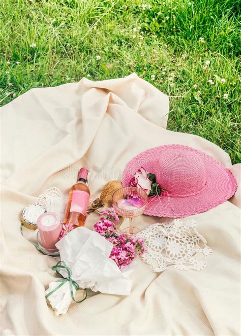 Lunch Picnic In The Park On The Green Grass With Baguette And Flowers