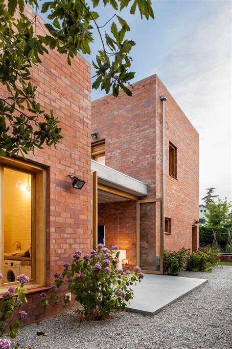 Modern Brick Home That Merges With The Garden DigsDigs