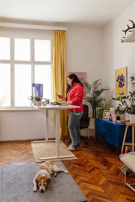 Woman Working At A Standing Desk By Stocksy Contributor Boris Jovanovic Stocksy