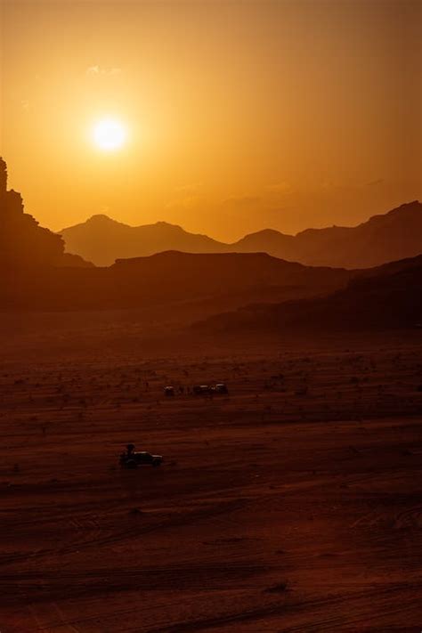 Silhouette of Mountains on Desert during Sunset · Free Stock Photo