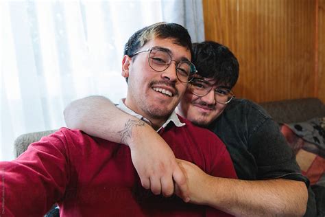 Latin Gay Couple Taking A Selfie On Sofa At Home By Stocksy Contributor Dani Nahuel Stocksy