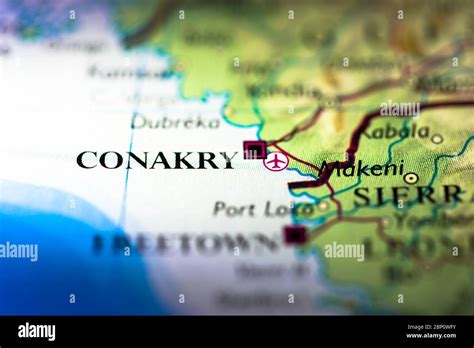 Shallow depth of field focus on geographical map location of Conakry ...