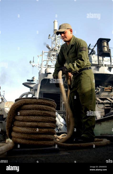 US Navy Engineman 2nd Class Coils Line Around A Bit As The Cyclone