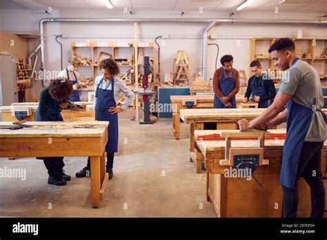 Wide Angle View Of Carpentry Workshop With Students Studying For