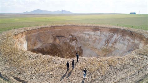 What causes a sinkhole to form?