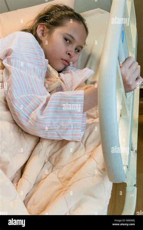 Mixed Race Asian American Tween Girl In Hospital Bed Stock Photo Alamy
