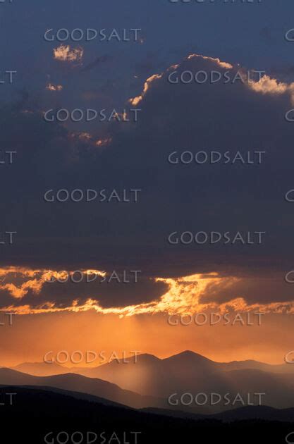 Orange Sunset With Clouds and Mountains - GoodSalt