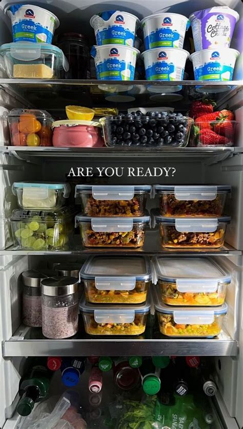 An Open Refrigerator Filled With Lots Of Food