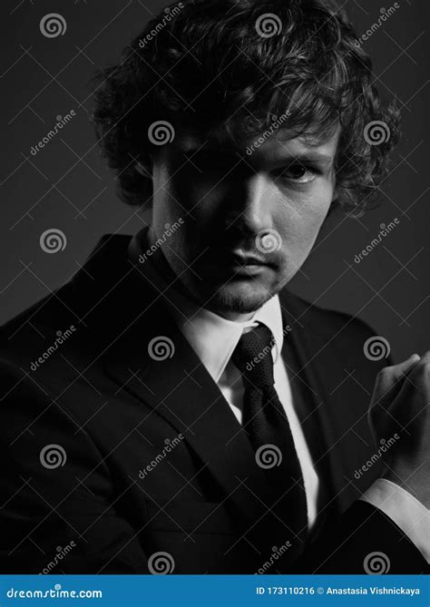 Handsome Charismatic Man Looking Serious In Dark Shadow Dramatic Light