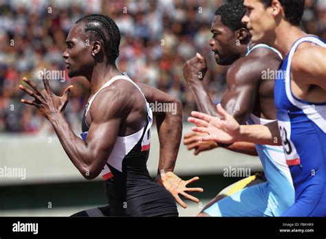 Athletes Running On Running Track Stock Photo Alamy