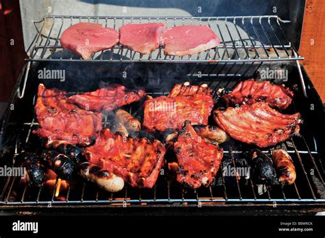 Meat Cooking On A Barbeque Stock Photo Alamy