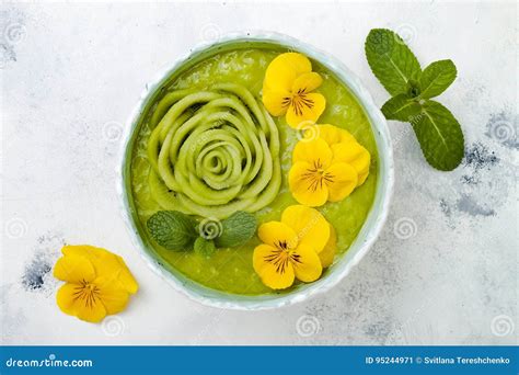 Breakfast Detox Green Smoothie Bowl Topped With Kiwi Rose And Edible