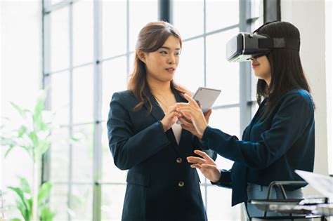 Excited Female Asian Testers Wearing Vr Glasses At Office Excited