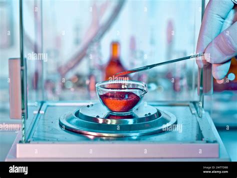 Scientist Conducting A Chemical Experiment In A Laboratory Stock Photo