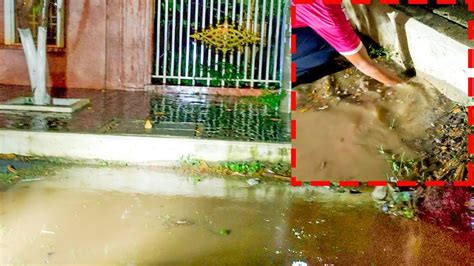 Unclogging Culvert Drain To Remove Trash And Plastic On Street Road