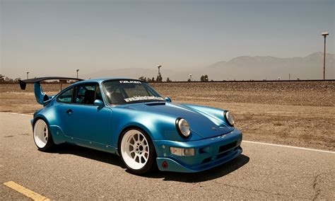 Blue Porsche 911 with blue spoiler on asphalt road HD wallpaper ...