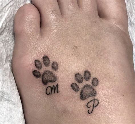 20 Best Paw Print Tattoos On Foot The Paws Foot Tattoos Tattoo