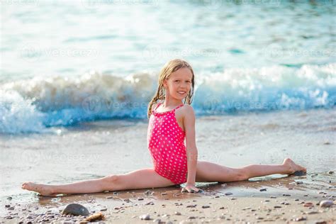 Active Little Girl At Beach Having A Lot Of Fun On The Seashore