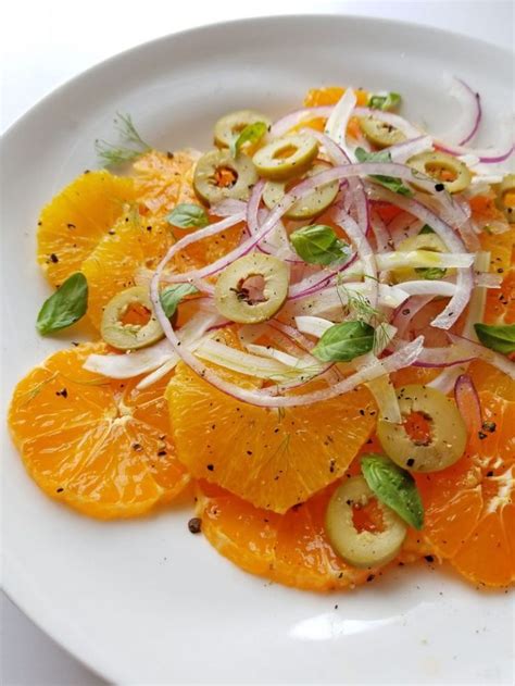 An Orange And Fennel Salad On A White Plate