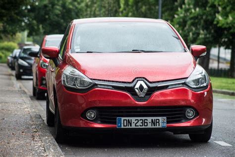 Front View Of Red Renault Clio Parked In The Street Editorial