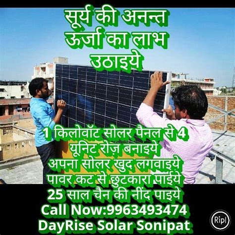 Two Men Are Installing Solar Panels On Top Of A Building With The