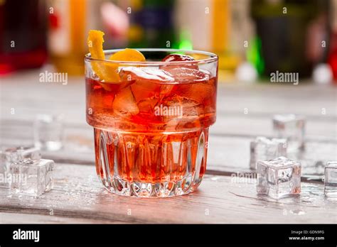 Dark orange drink in glass Stock Photo - Alamy