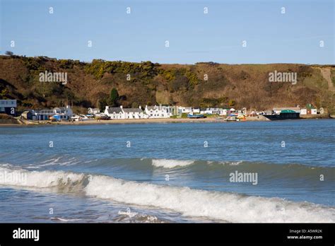 View Across Blue Sea With White Breaking Waves To Penrhyn Nefyn In