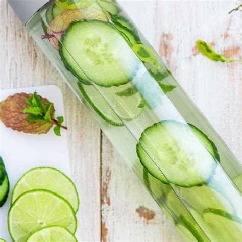 Detox Infused Water With Cucumber Lime And Mint In Bottle Stock Image