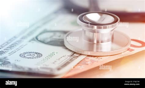 Medical Stethoscope Close Up On Top Of Dollar Banknotes Side View Stock