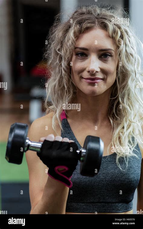 Beautiful Woman Lifting Dumbbell Stock Photo Alamy