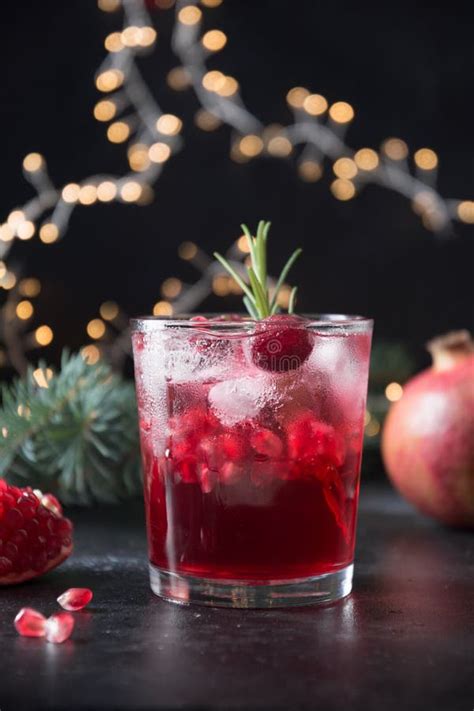 Pomegranate Christmas Cocktail With Sparkling Wine Garnish Rosemary