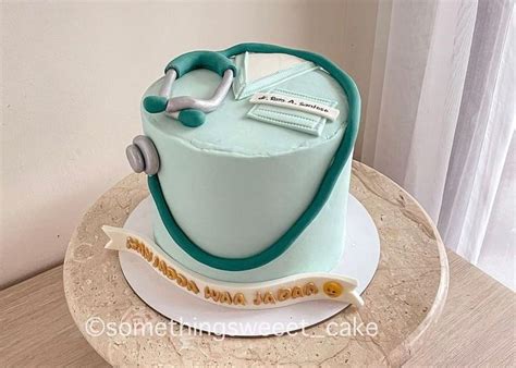 A Cake With A Stethoscope On It Sitting On Top Of A Table