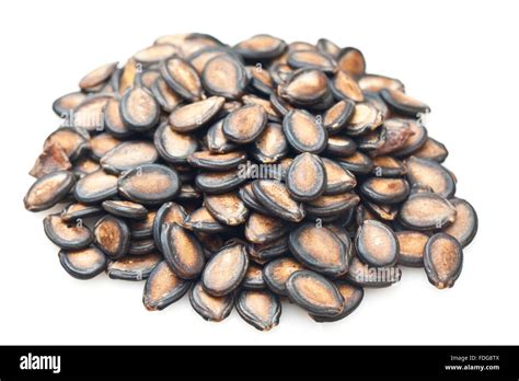 Black watermelon seeds isolated on white background Stock Photo - Alamy