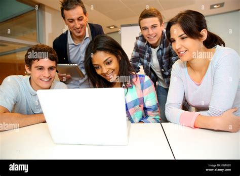 Group Of Students In Computer Training With Teacher Stock Photo Alamy