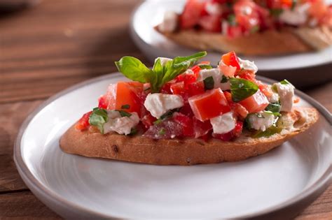 Premium Photo Bruschetta With Tomatoes Feta Cheese And Basil